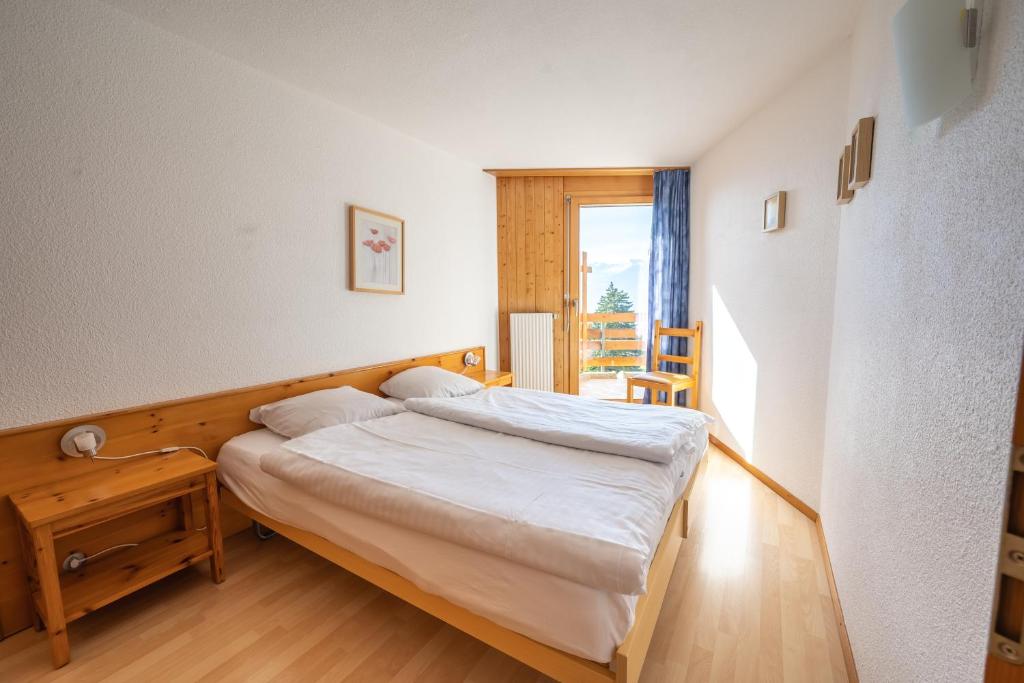 Postel nebo postele na pokoji v ubytování Eden Resort Anzère