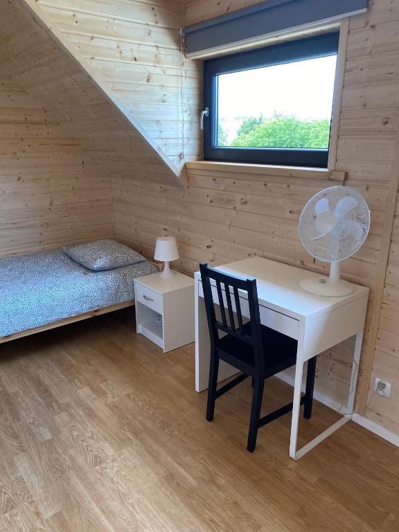 Posteľ alebo postele v izbe v ubytovaní OSADA JANTAr 3 DOM 70m2