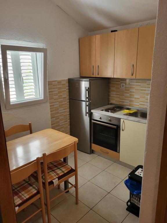 Kuchyň nebo kuchyňský kout v ubytování Apartman Ivan