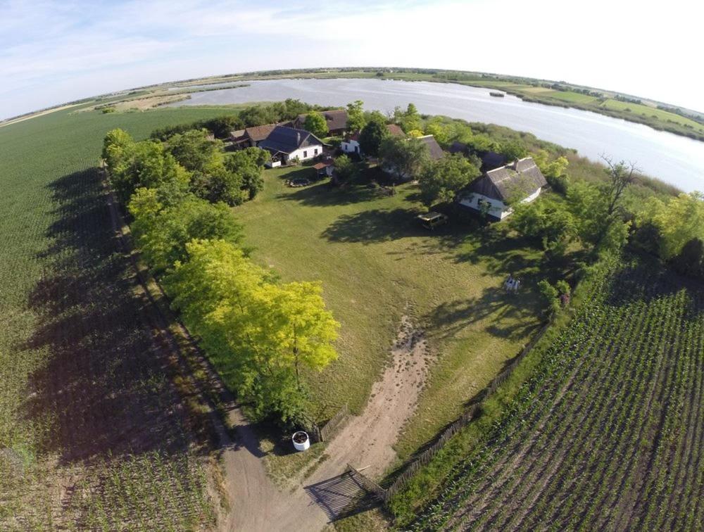 an aerial view of a house on an island in the water at Róka's- Farm in Šupljak