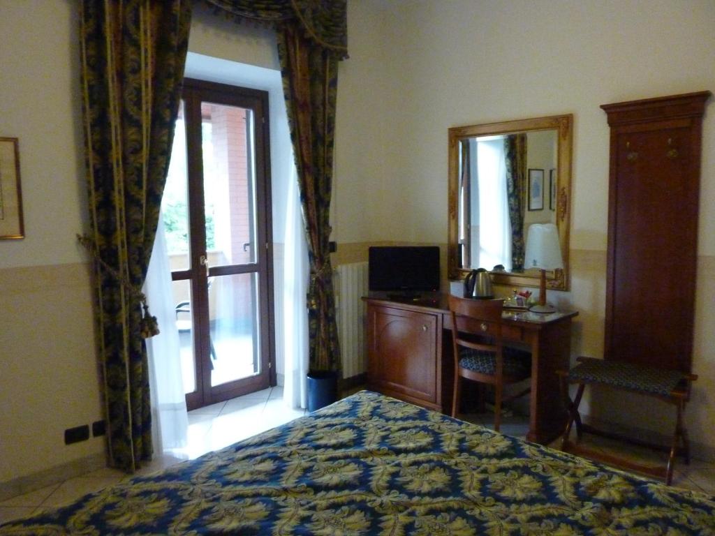 Postel nebo postele na pokoji v ubytování Hotel Belvedere