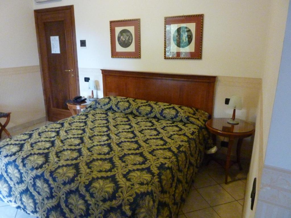 Postel nebo postele na pokoji v ubytování Hotel Belvedere