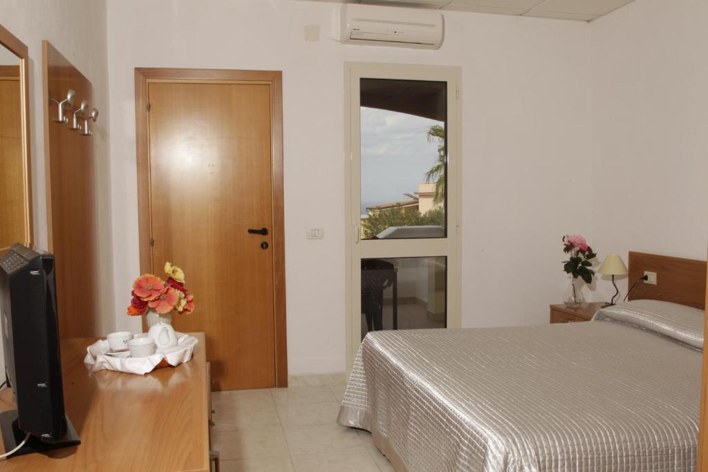 Posteľ alebo postele v izbe v ubytovaní Hotel Club Bellavista