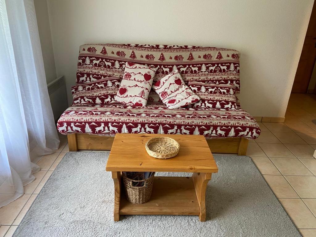 a living room with a couch and a table at Les Frahans in Samoëns