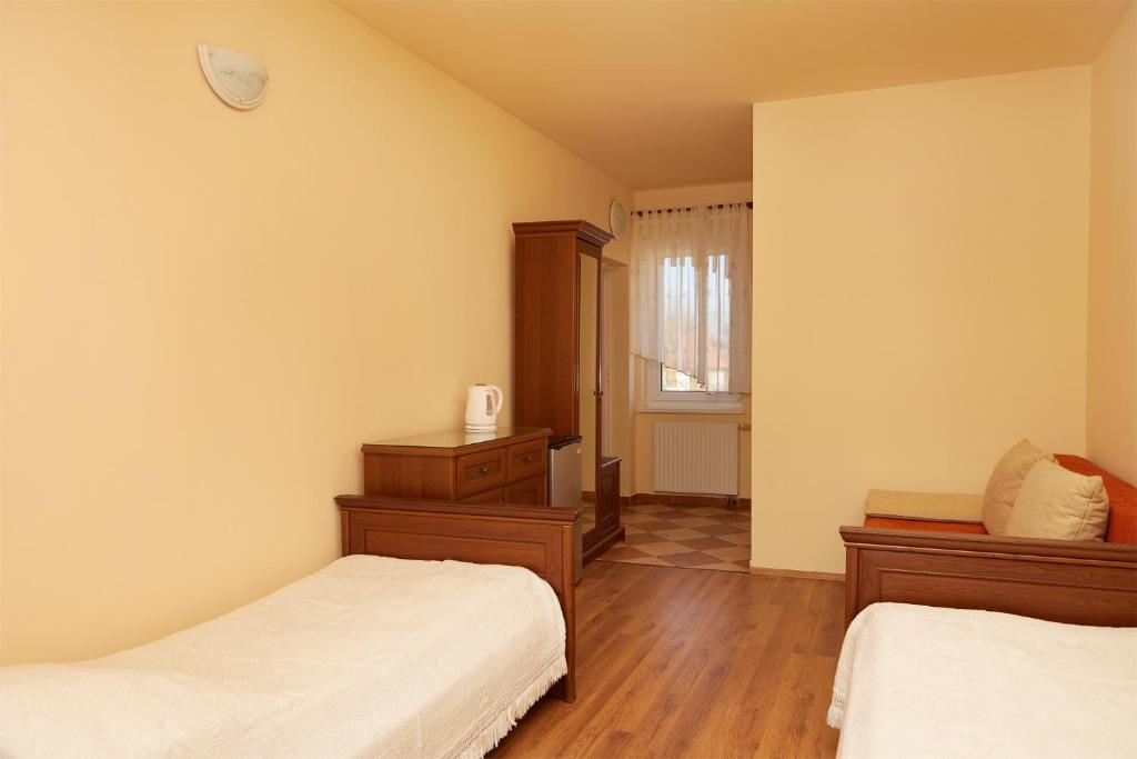 Postel nebo postele na pokoji v ubytování Dom na Wzgórzu