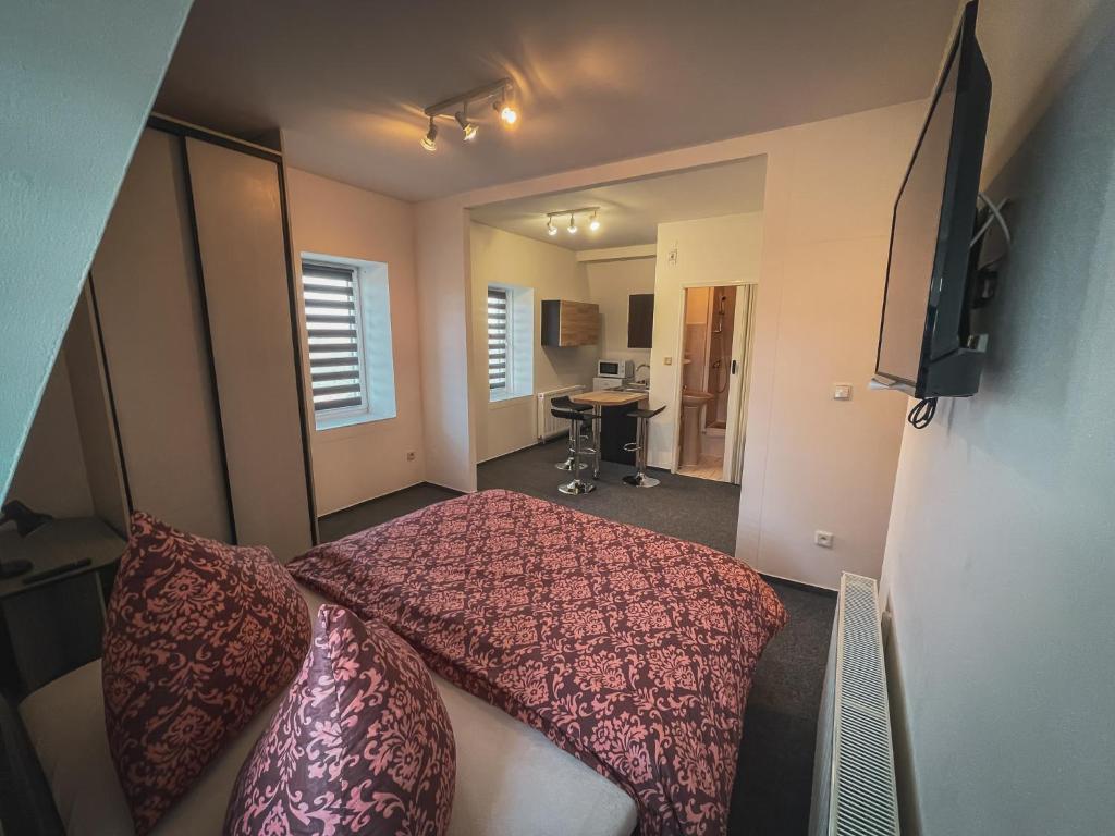 TV o dispositivi per l'intrattenimento presso Hotel Apartment Faraon