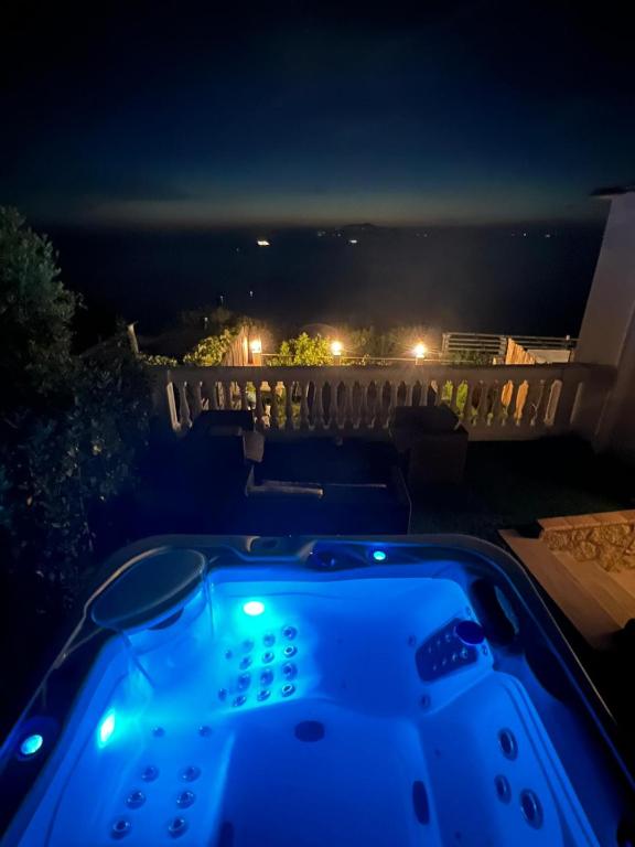 a hot tub at night with a view at B&B Il Paradiso di Capri in Anacapri