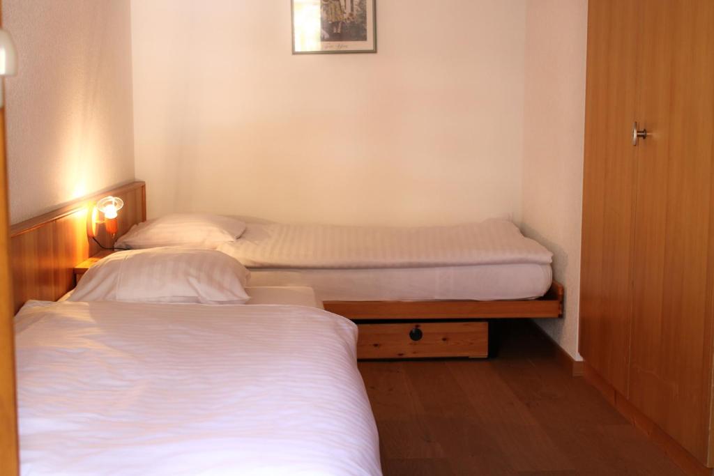 Postel nebo postele na pokoji v ubytování Eden Resort Anzère