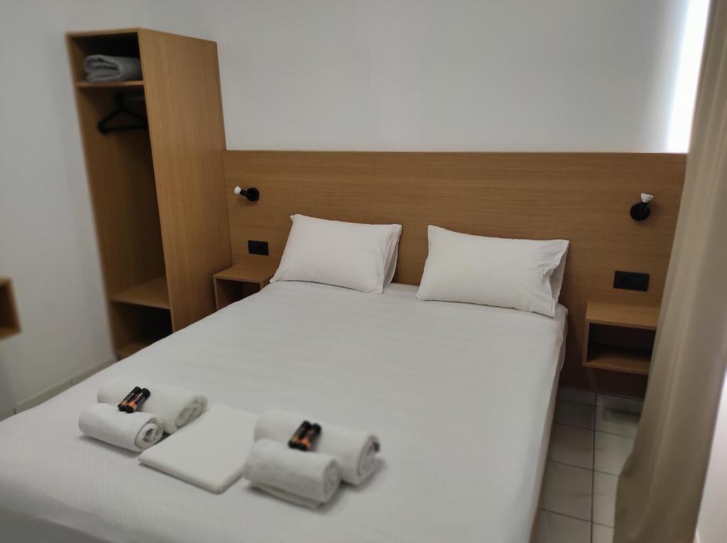 Postel nebo postele na pokoji v ubytování SMAROULA