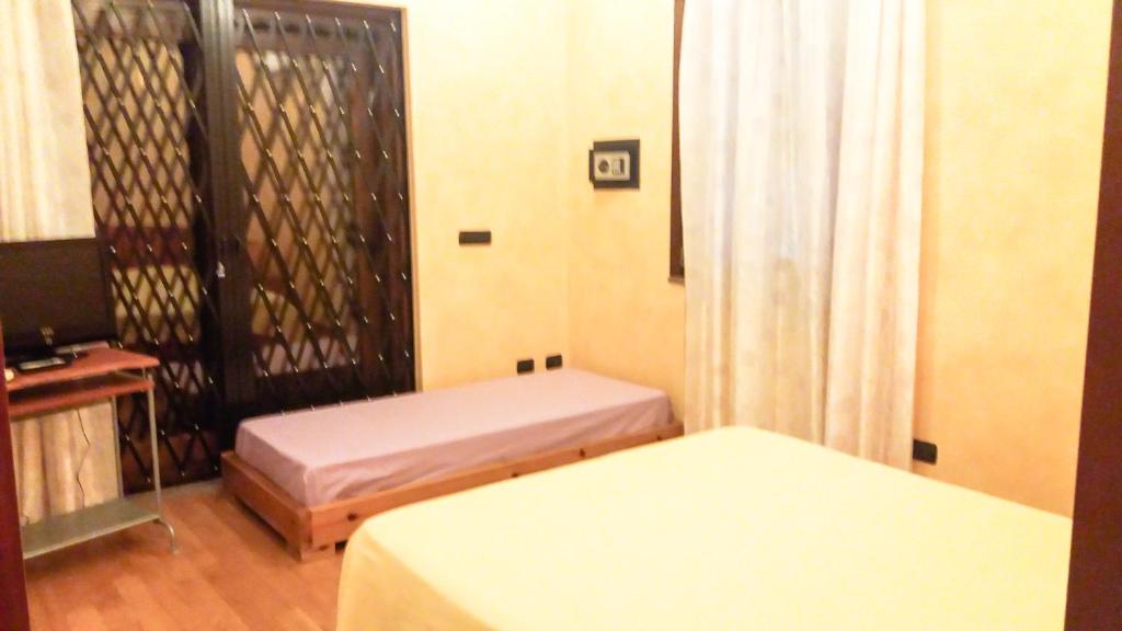 Postel nebo postele na pokoji v ubytování Villa Luna e' Pedra - Suite in Villa con Vista sulla Baia di Alghero e Piscina