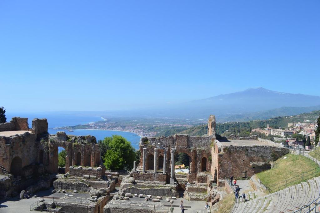 an aerial view of the ruins of the ancient city at Taormina al mare Villetta in Mazzeo