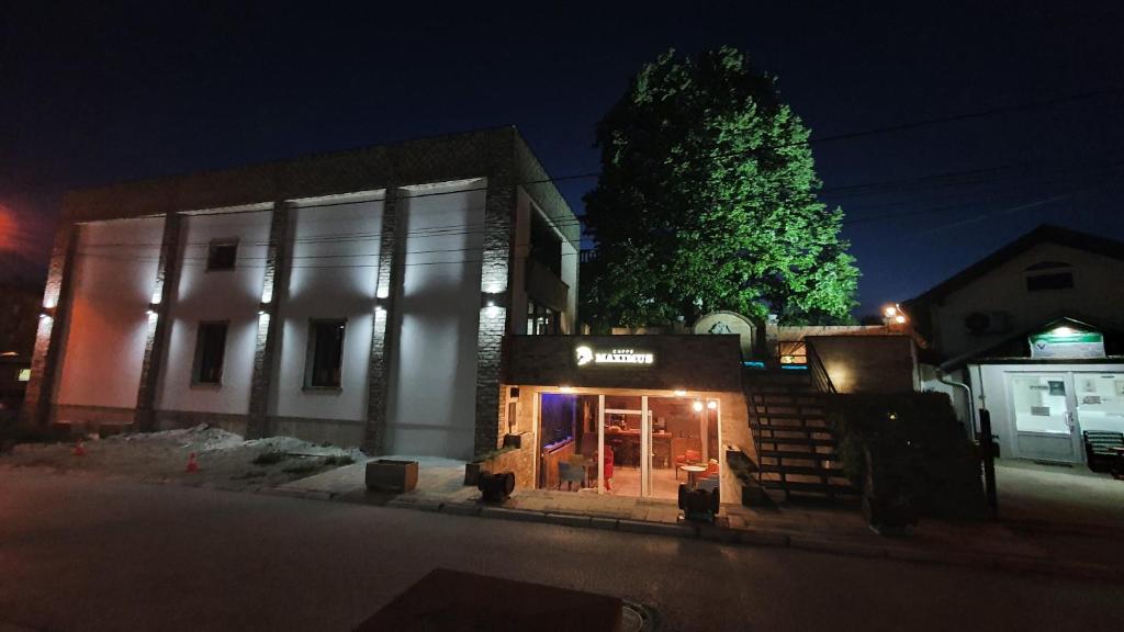 a building on a street at night at Motel Castello in Smederevska Palanka