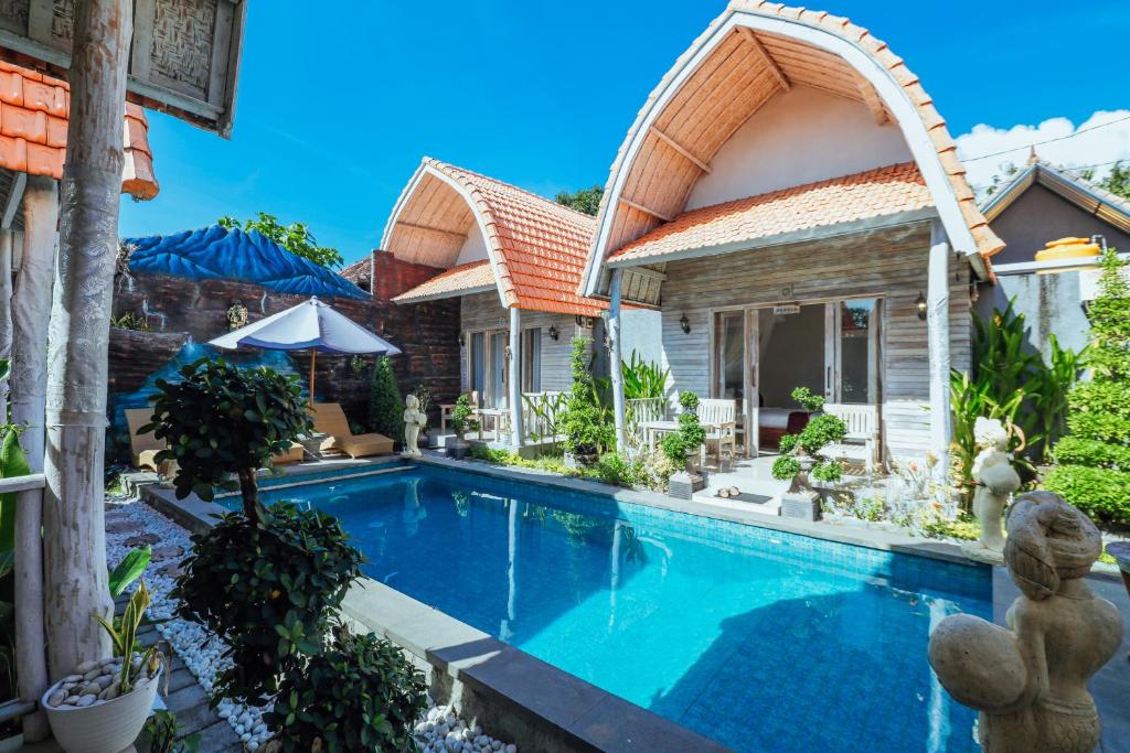 an image of a house with a swimming pool at The Box Paradise Cottage in Nusa Penida