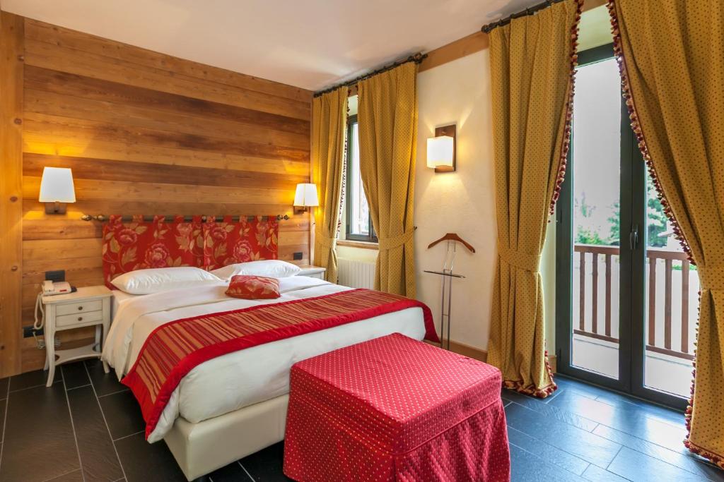 Posteľ alebo postele v izbe v ubytovaní Hotel Lo Scoiattolo