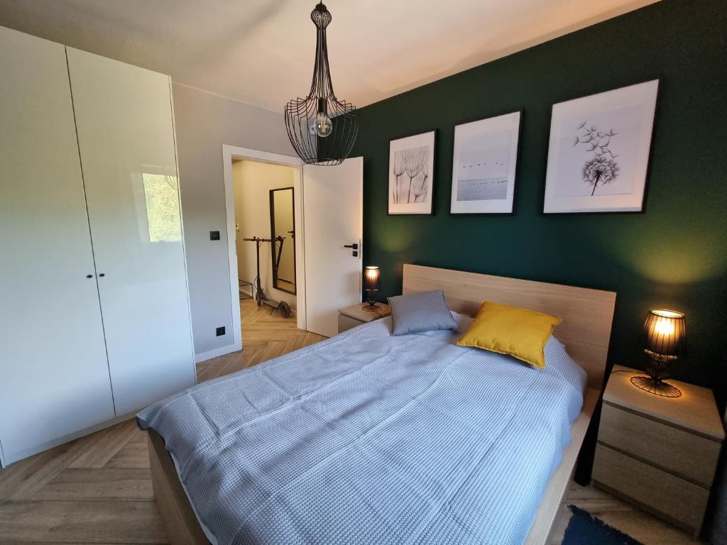Postel nebo postele na pokoji v ubytování Apartament Wiślańskie Skije