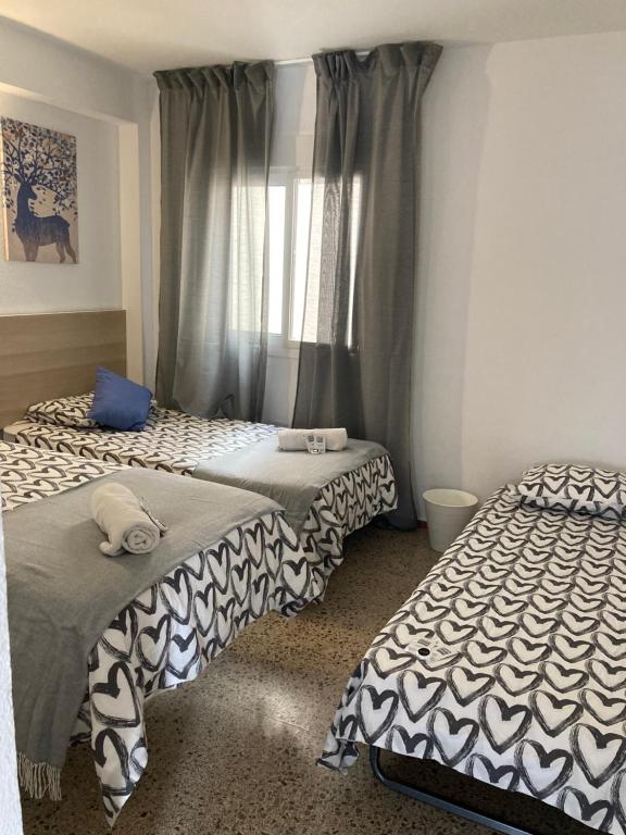 Posteľ alebo postele v izbe v ubytovaní Mi Rancho