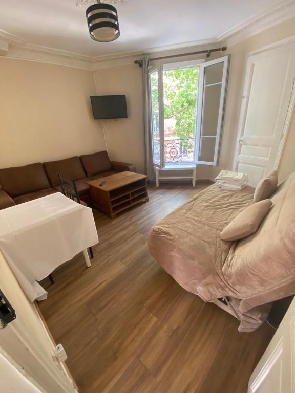Postel nebo postele na pokoji v ubytování RENT APPART - La Garenne Colombes