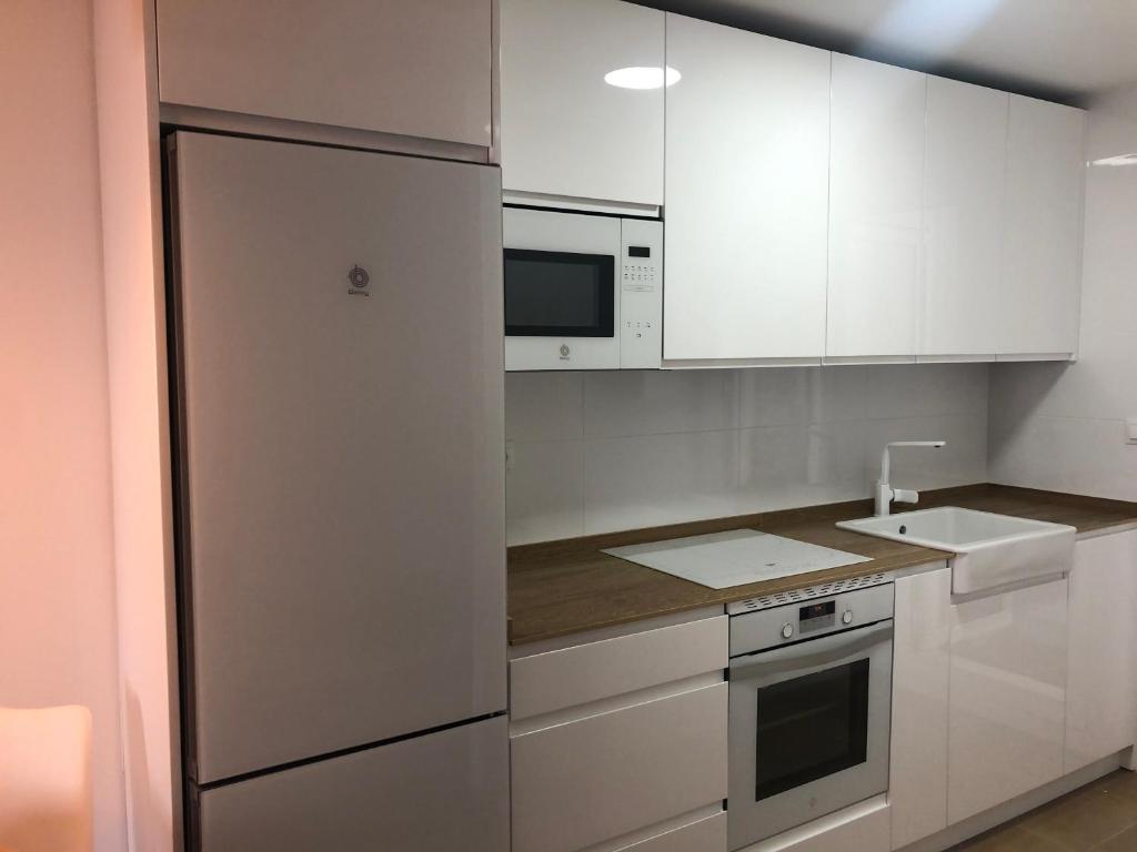 Kuchyň nebo kuchyňský kout v ubytování Apartamento Punta Candor Rota