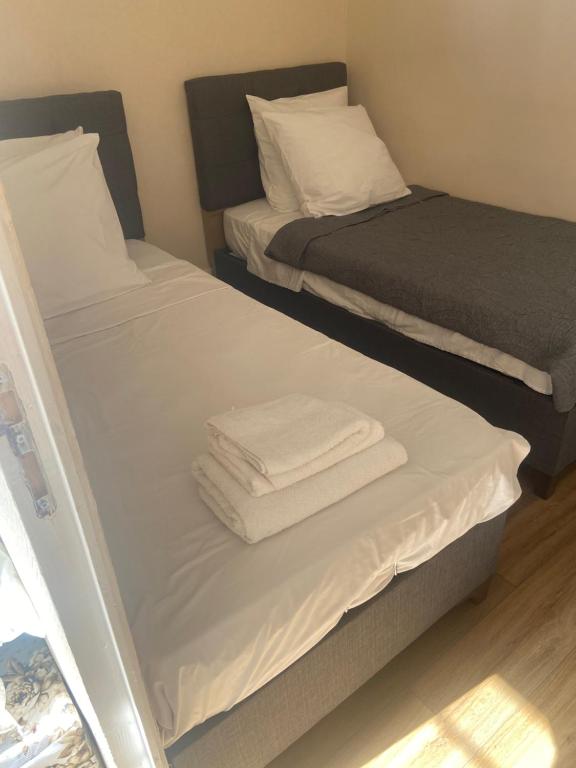 Postel nebo postele na pokoji v ubytování RENT APPART - La Garenne Colombes