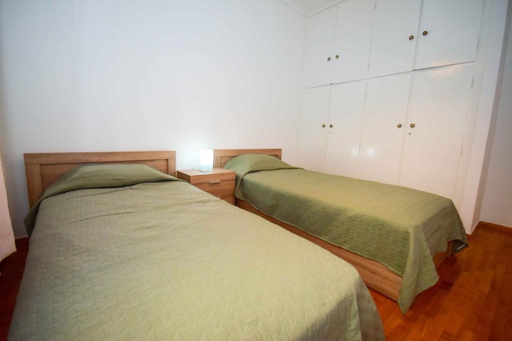 Posteľ alebo postele v izbe v ubytovaní Filoxenia Apartment Athens