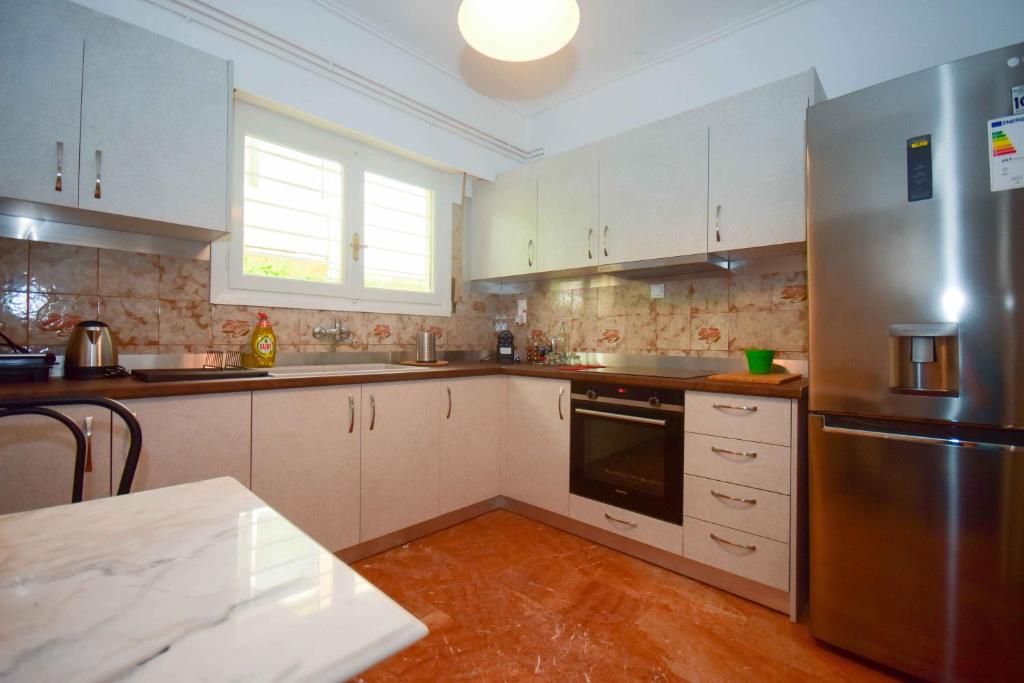 Kuchyňa alebo kuchynka v ubytovaní Filoxenia Apartment Athens