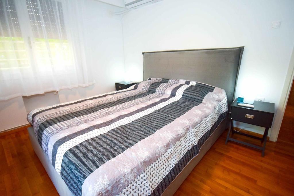 Posteľ alebo postele v izbe v ubytovaní Filoxenia Apartment Athens