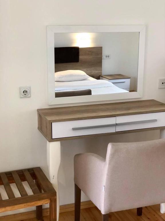 Postel nebo postele na pokoji v ubytování Konak Nestor Bungalows