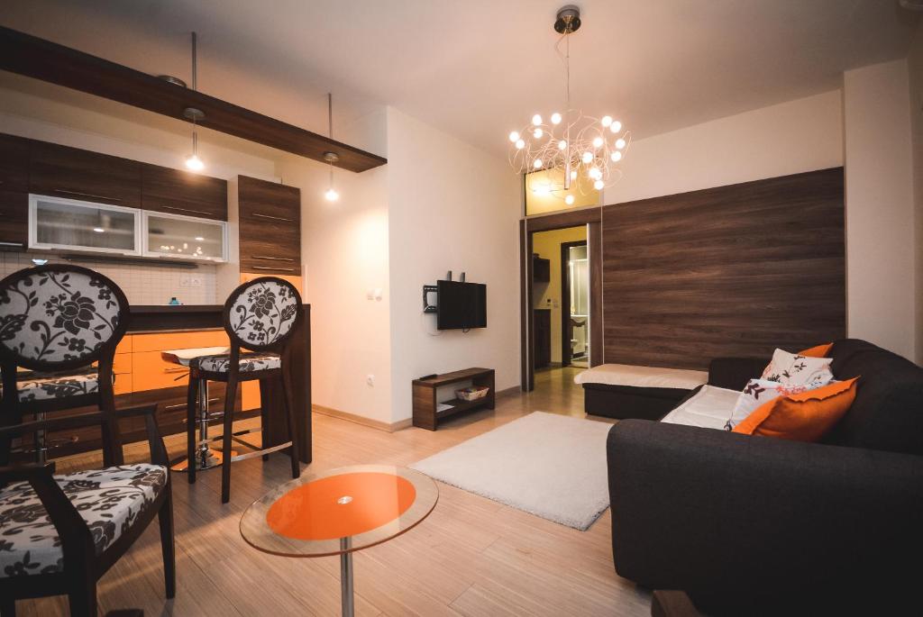 a living room with a couch and a table at Apartment Ilunion I in Vrnjačka Banja