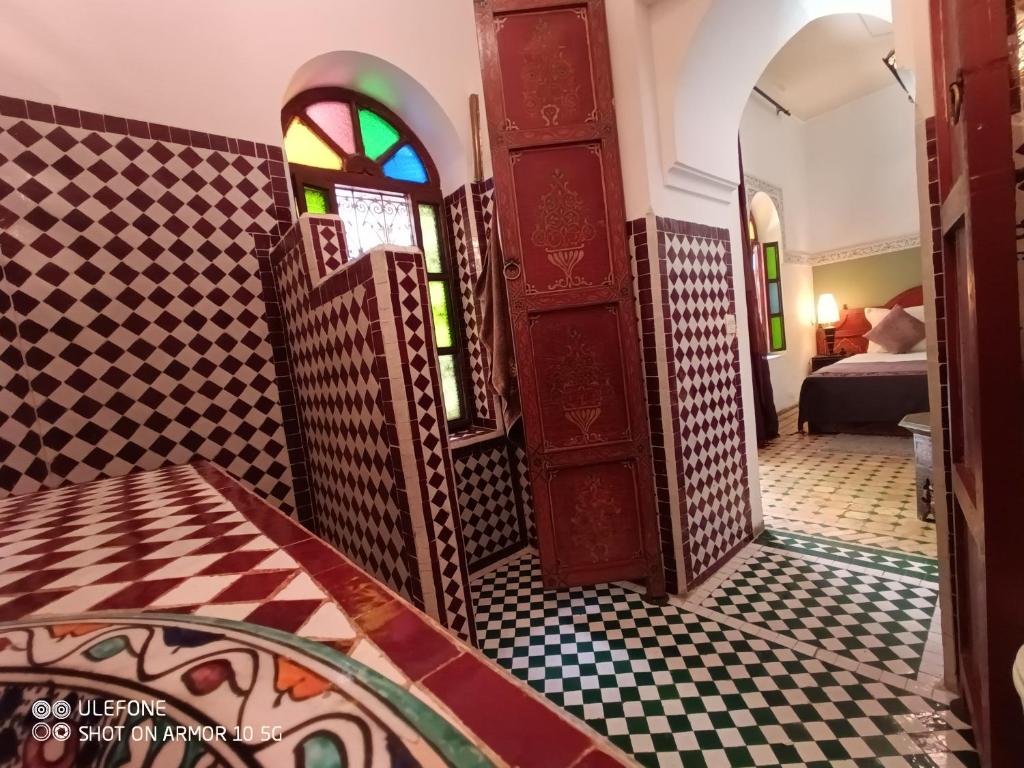 Postel nebo postele na pokoji v ubytování Riad Zagouda