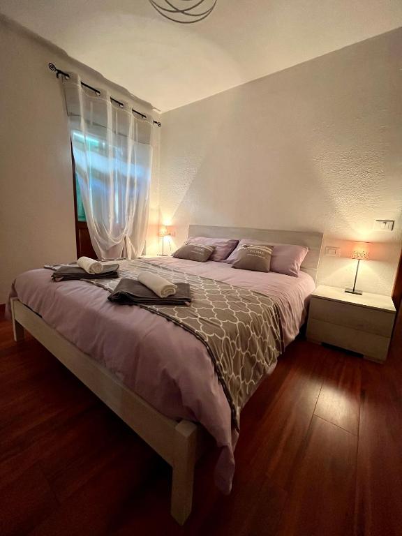 Postel nebo postele na pokoji v ubytování Cadore apartment