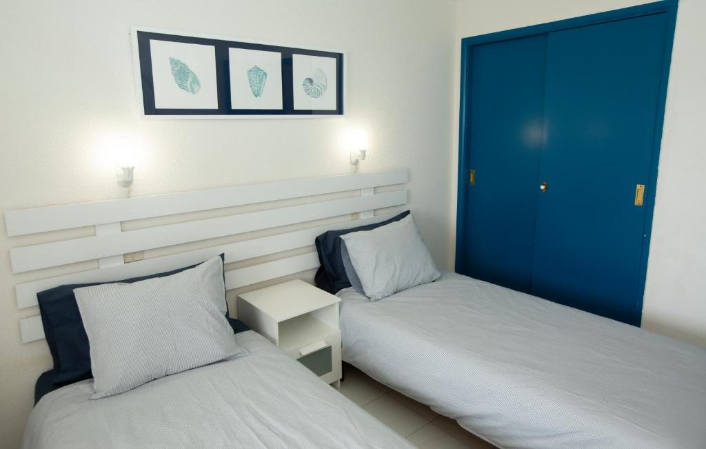 Posteľ alebo postele v izbe v ubytovaní Doñana Apartamento Sunset first line to the beach