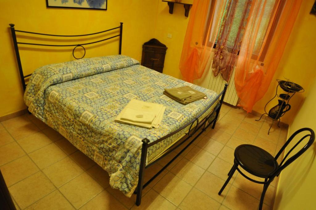 Postel nebo postele na pokoji v ubytování Ostello Del Volo