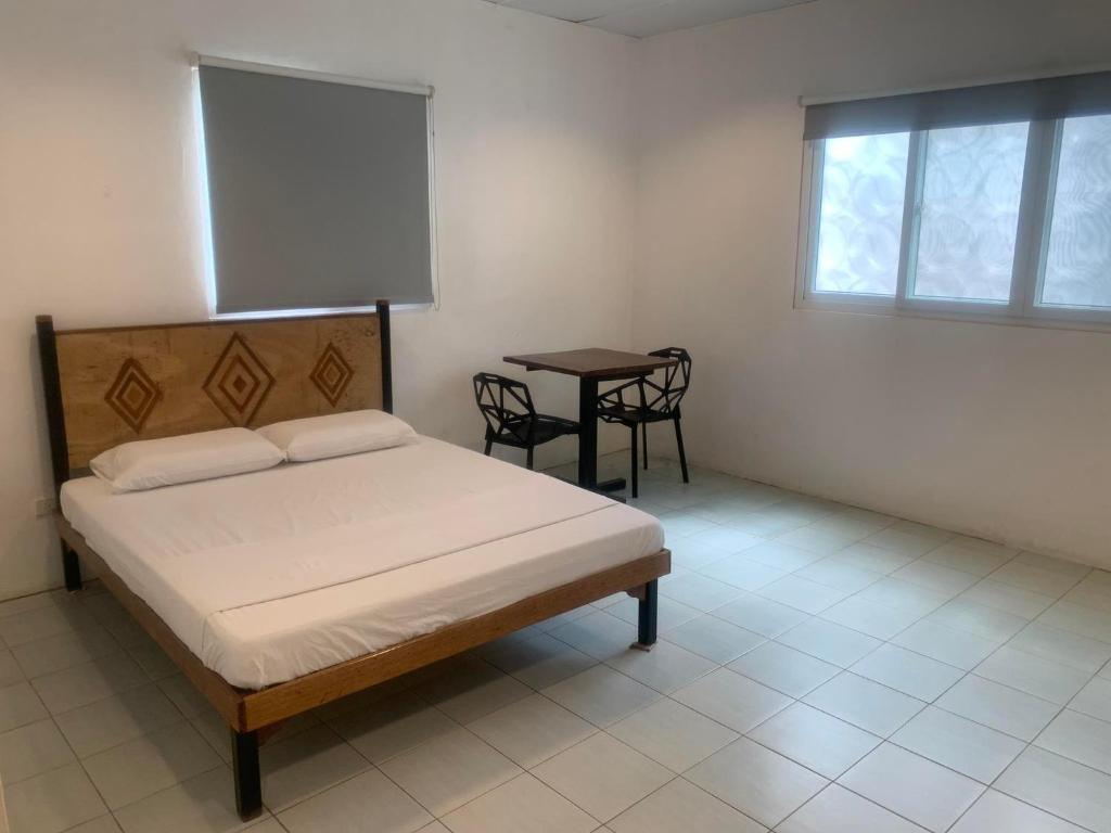 Postel nebo postele na pokoji v ubytování Nacho Hostel Cebu