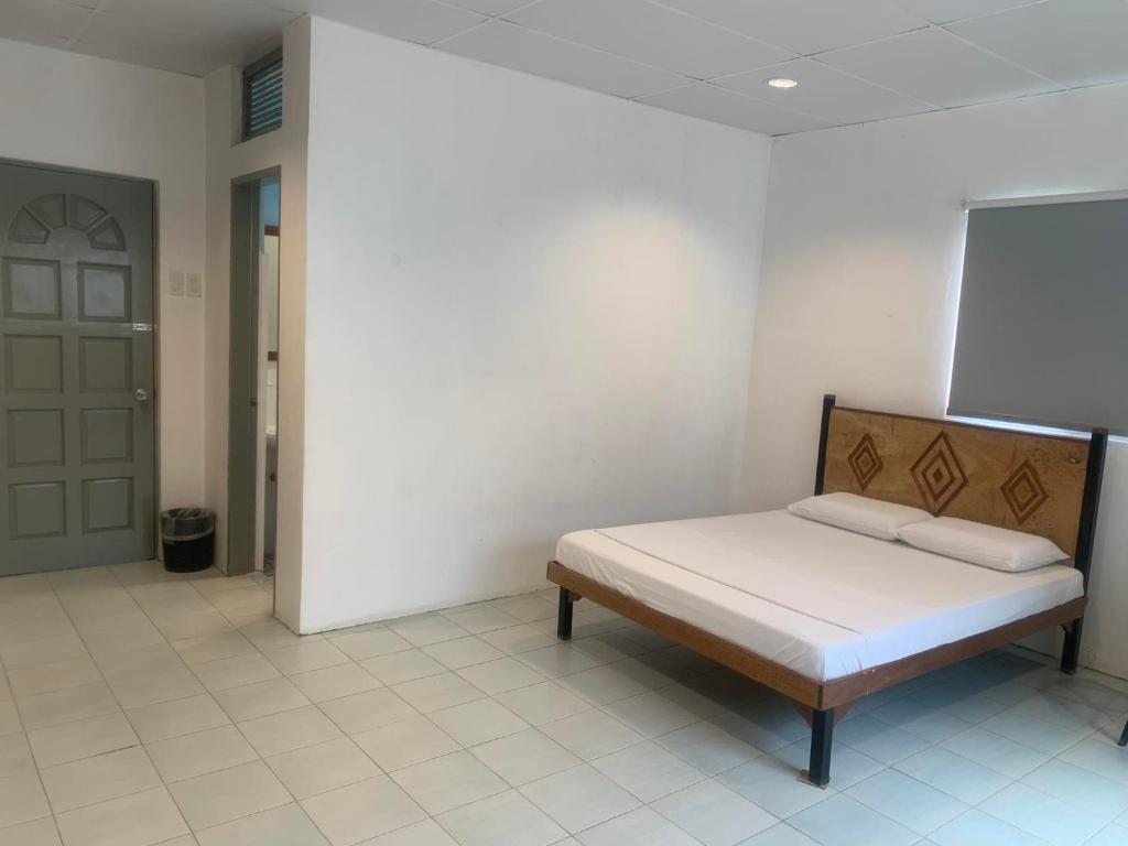 Postel nebo postele na pokoji v ubytování Nacho Hostel Cebu