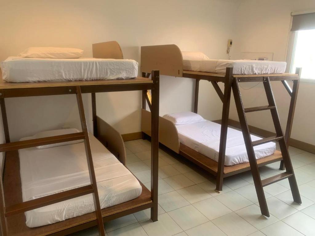 Postel nebo postele na pokoji v ubytování Nacho Hostel Cebu