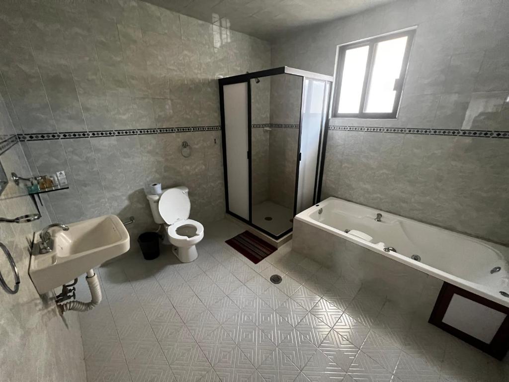 Koupelna v ubytování Hotel Tres Flores