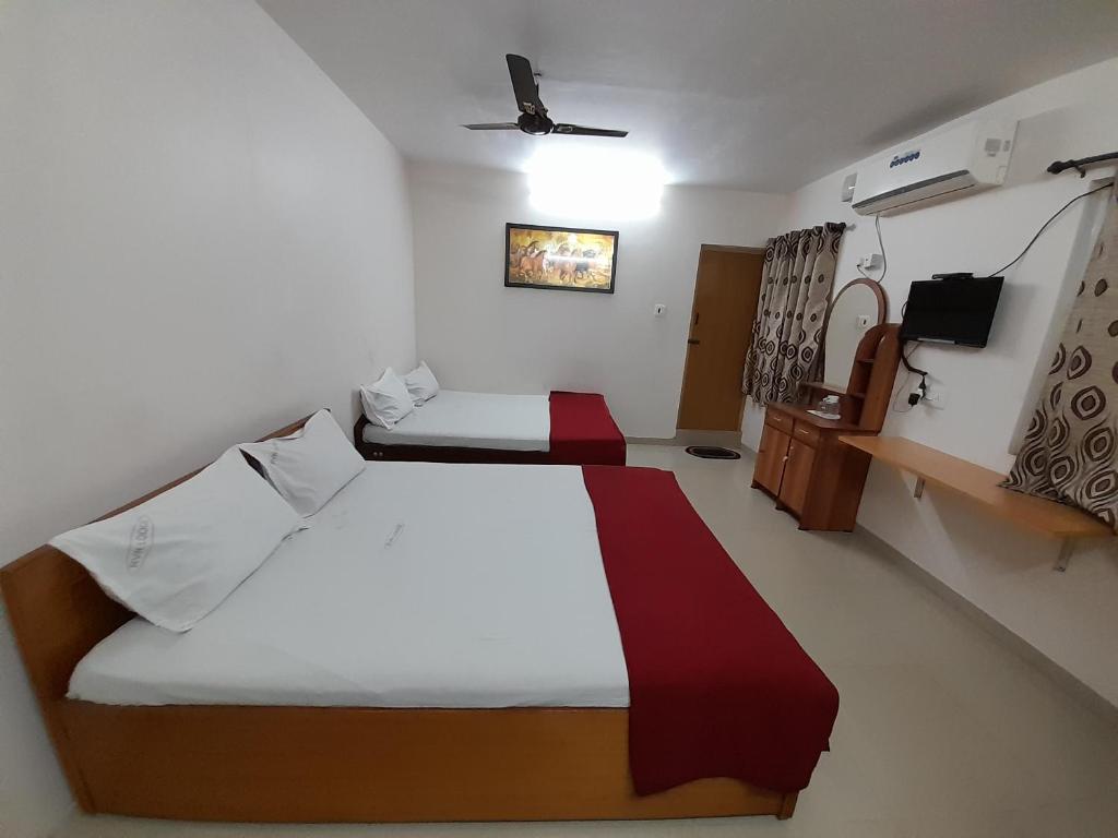 Postel nebo postele na pokoji v ubytování SUPREME RESIDENCY