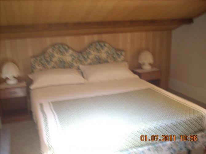 A bed or beds in a room at Stella Marina