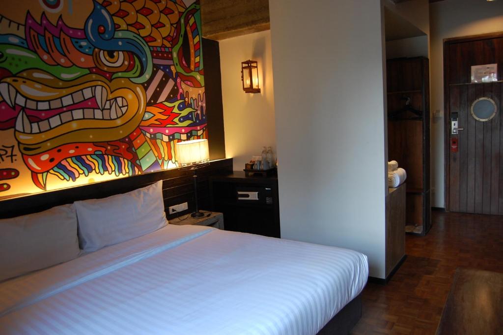 Postel nebo postele na pokoji v ubytování Cacha Hotel