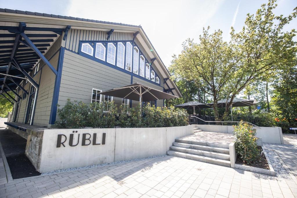 a building with a sign that reads rubilli at Rübli in Freiberg am Neckar