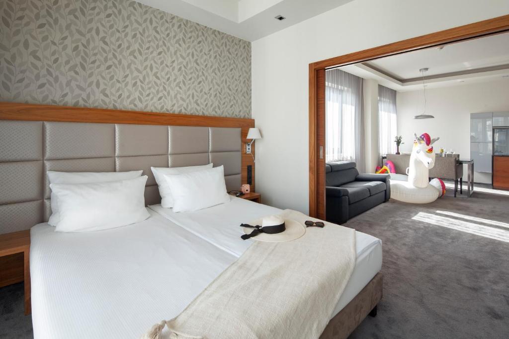 Postel nebo postele na pokoji v ubytování Sea Premium Apartments - Destigo Hotels