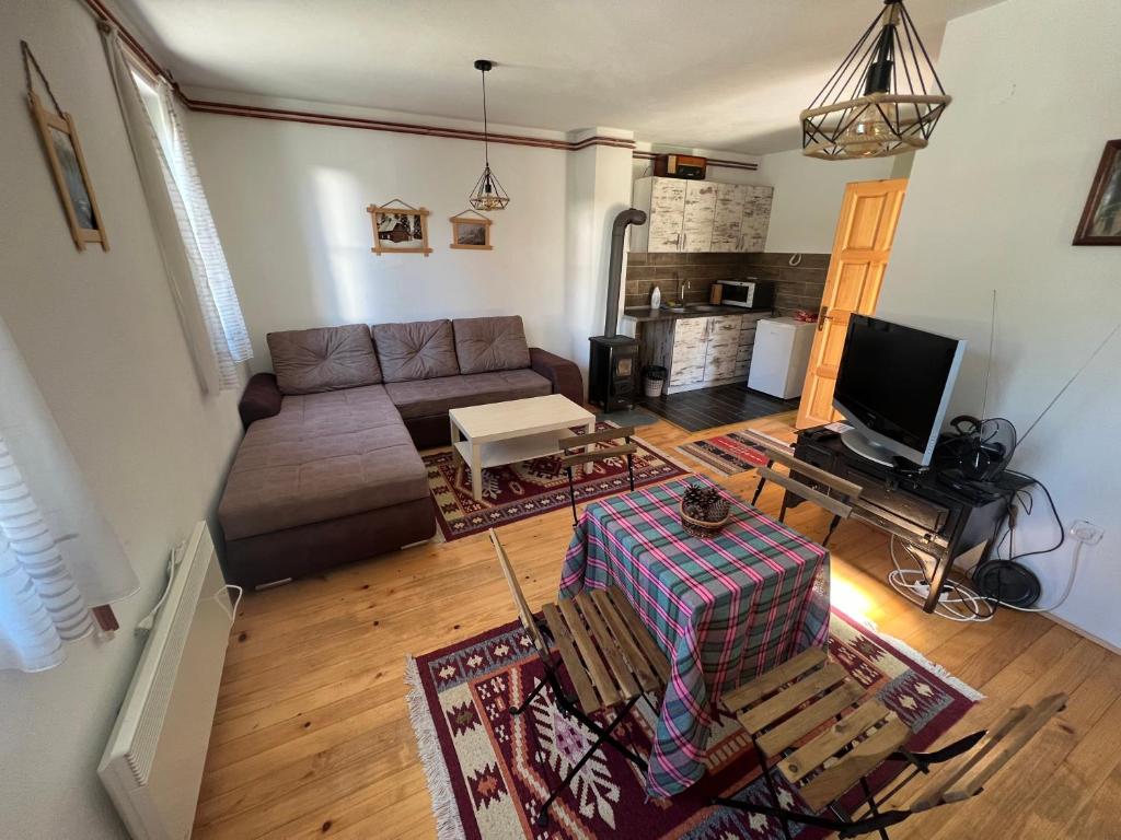 Predel za sedenje v nastanitvi Dormire Apartmans