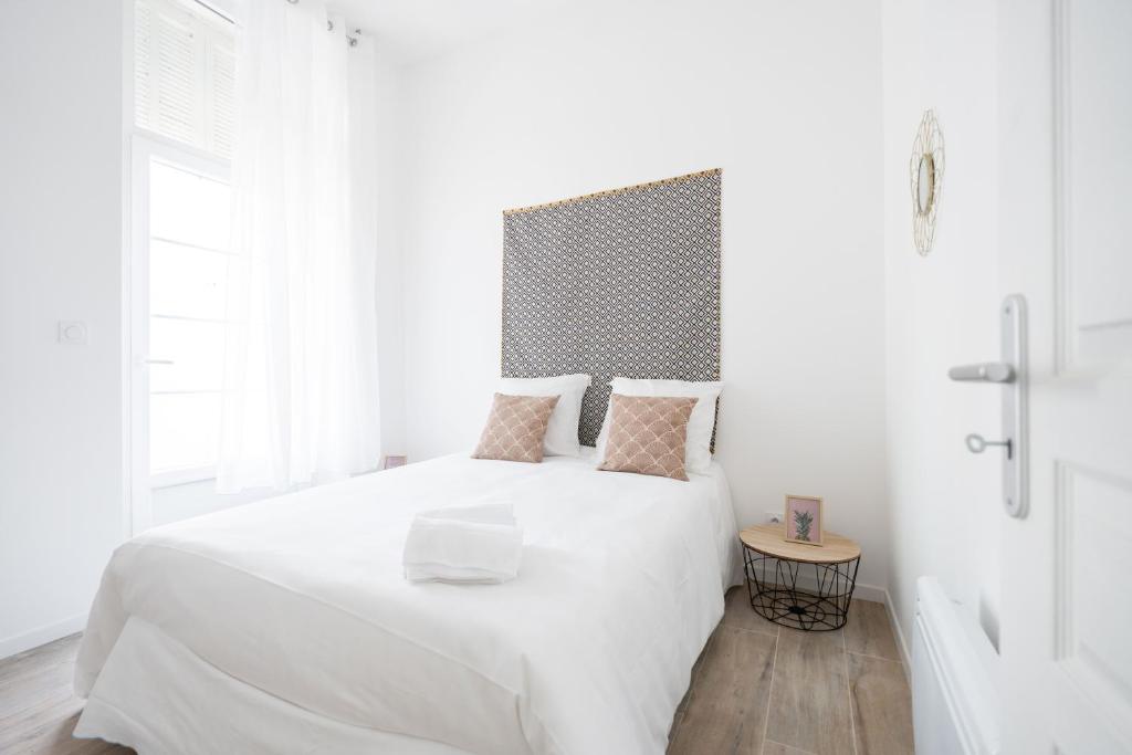 Posteľ alebo postele v izbe v ubytovaní Le Concorde 1 - Appartement 1 chambre Terrasse Clim Calanques Vélodrome