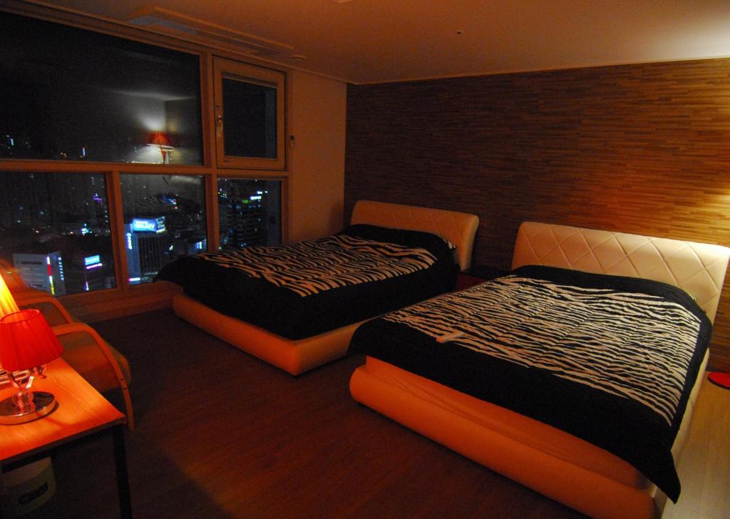 Postel nebo postele na pokoji v ubytování Dynamic Guesthouse