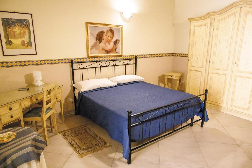 Postel nebo postele na pokoji v ubytování B&B Principe Augusta