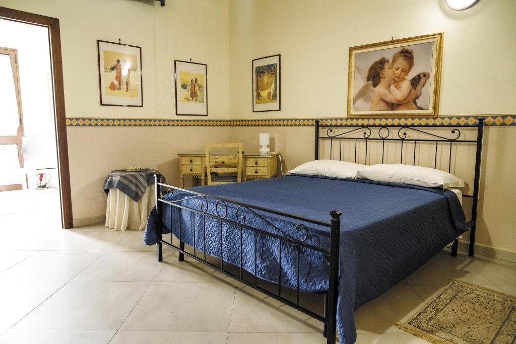 Postel nebo postele na pokoji v ubytování B&B Principe Augusta