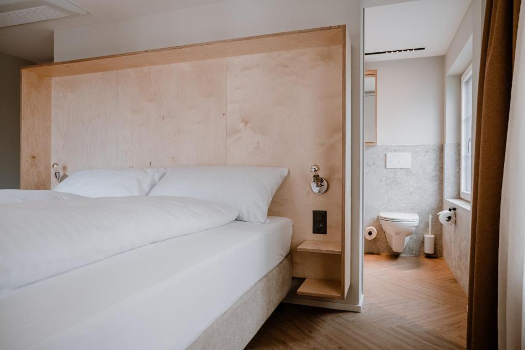 Postel nebo postele na pokoji v ubytování Hotel Müllers Self-Check-In