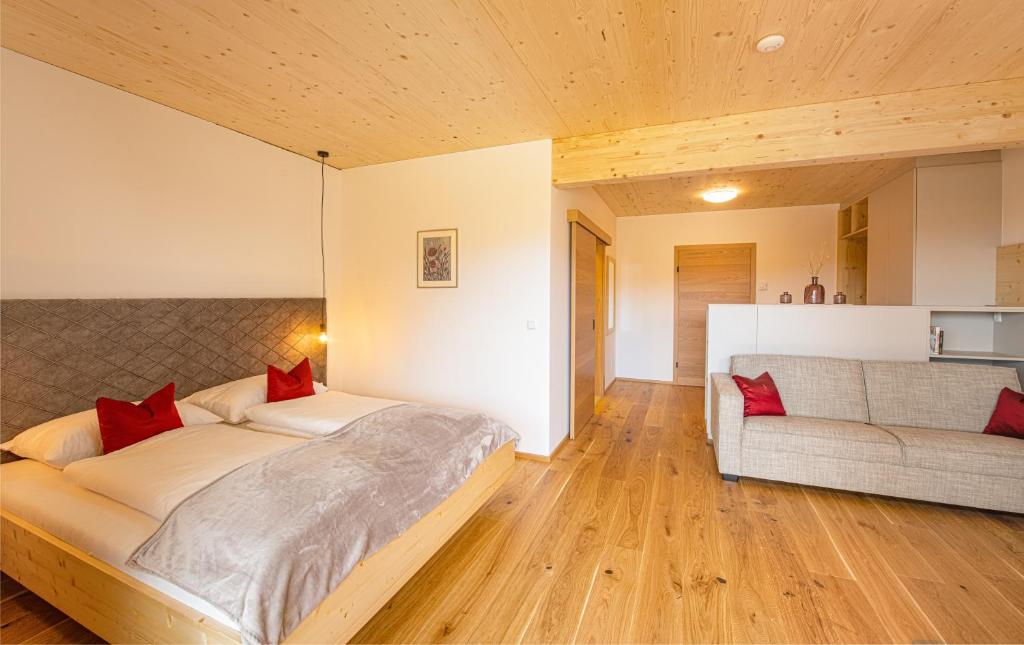 A bed or beds in a room at Pircherhof - Adults Only am Biobauernhof