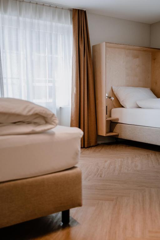 Postel nebo postele na pokoji v ubytování Hotel Müllers Self-Check-In
