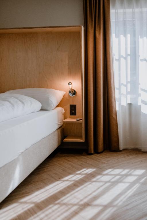 Postel nebo postele na pokoji v ubytování Hotel Müllers Self-Check-In